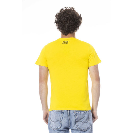 Man wearing yellow t-shirt and blue jeans