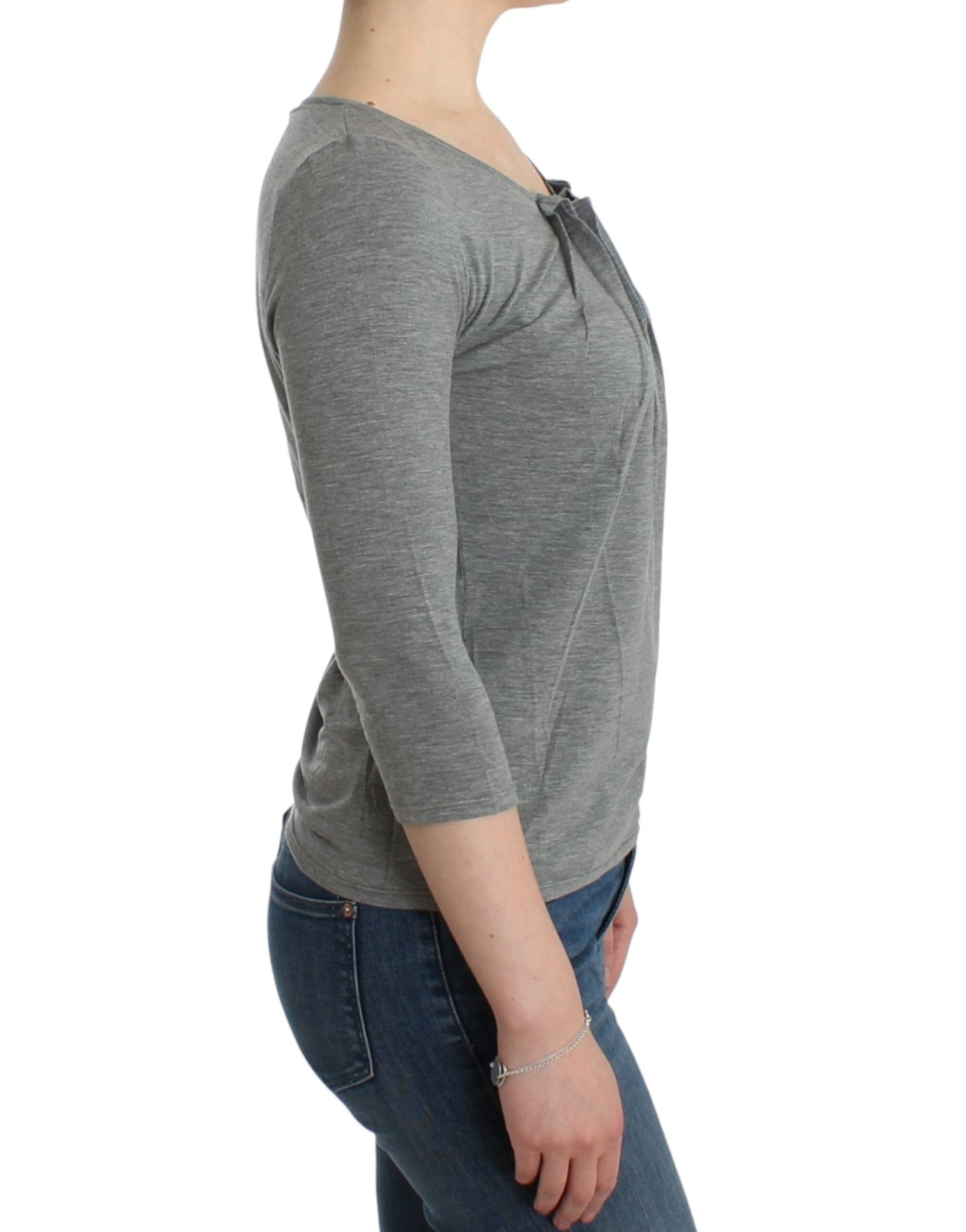 Woman wearing long sleeve shirt and jeans