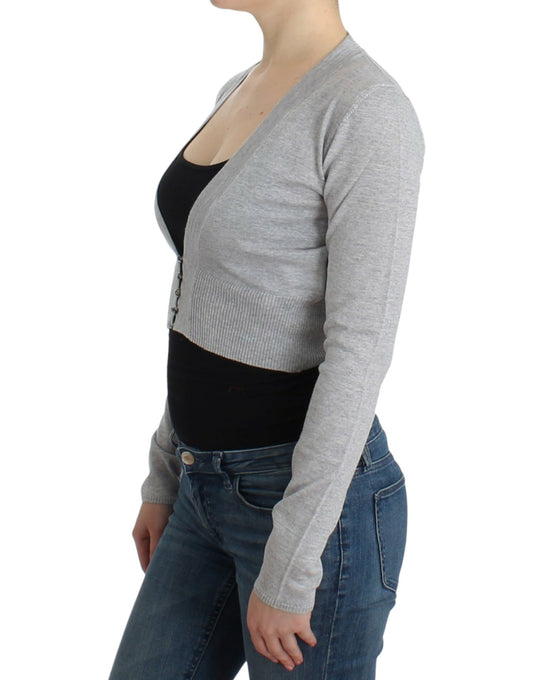 Woman wearing a gray cardigan over black tank top