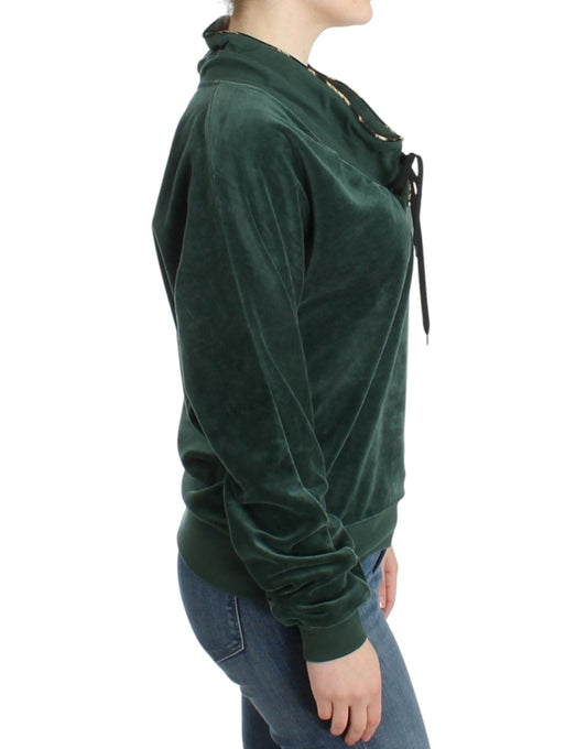 Woman wearing green velvet sweatshirt