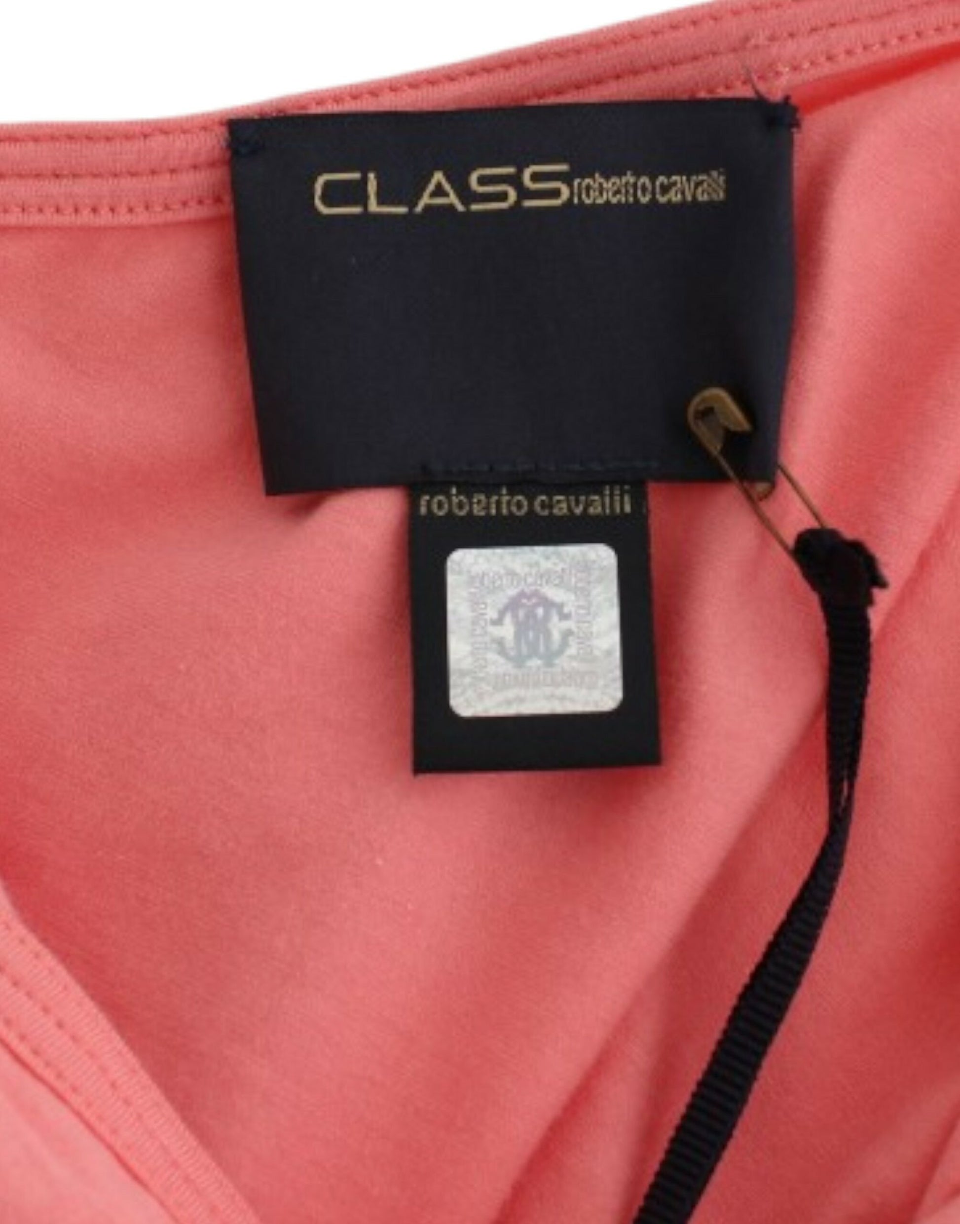 Pink sports bra on hanger with tags