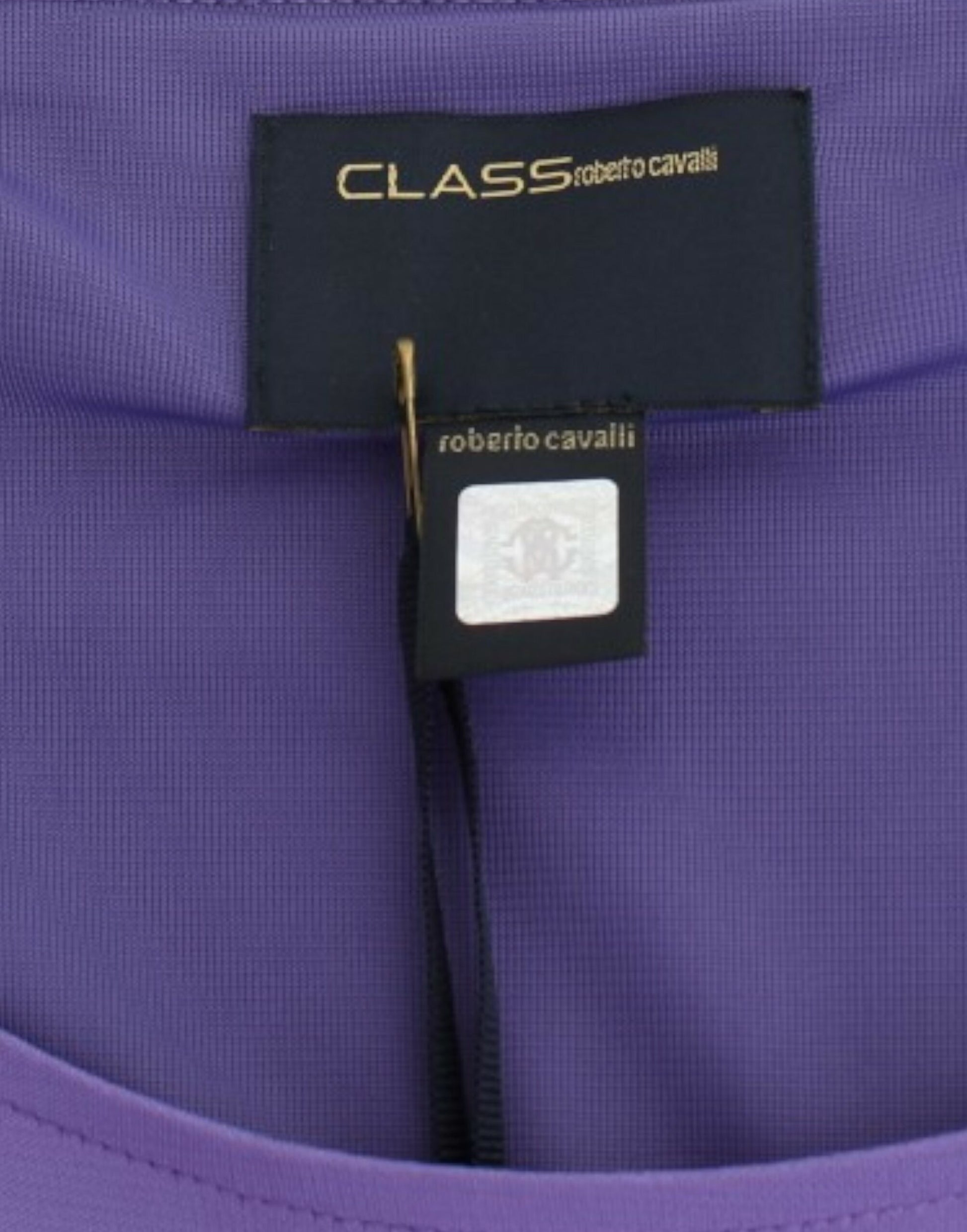 A purple long sleeve dress with a label that reads "Classic" and "Roberto Cavalli"