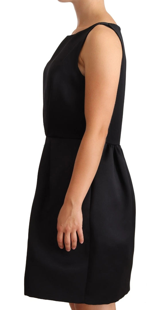 A black sleeveless pleated aline knee length dress