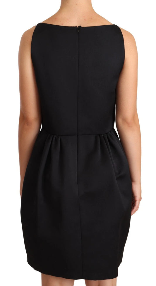 A black sleeveless pleated aline knee length dress