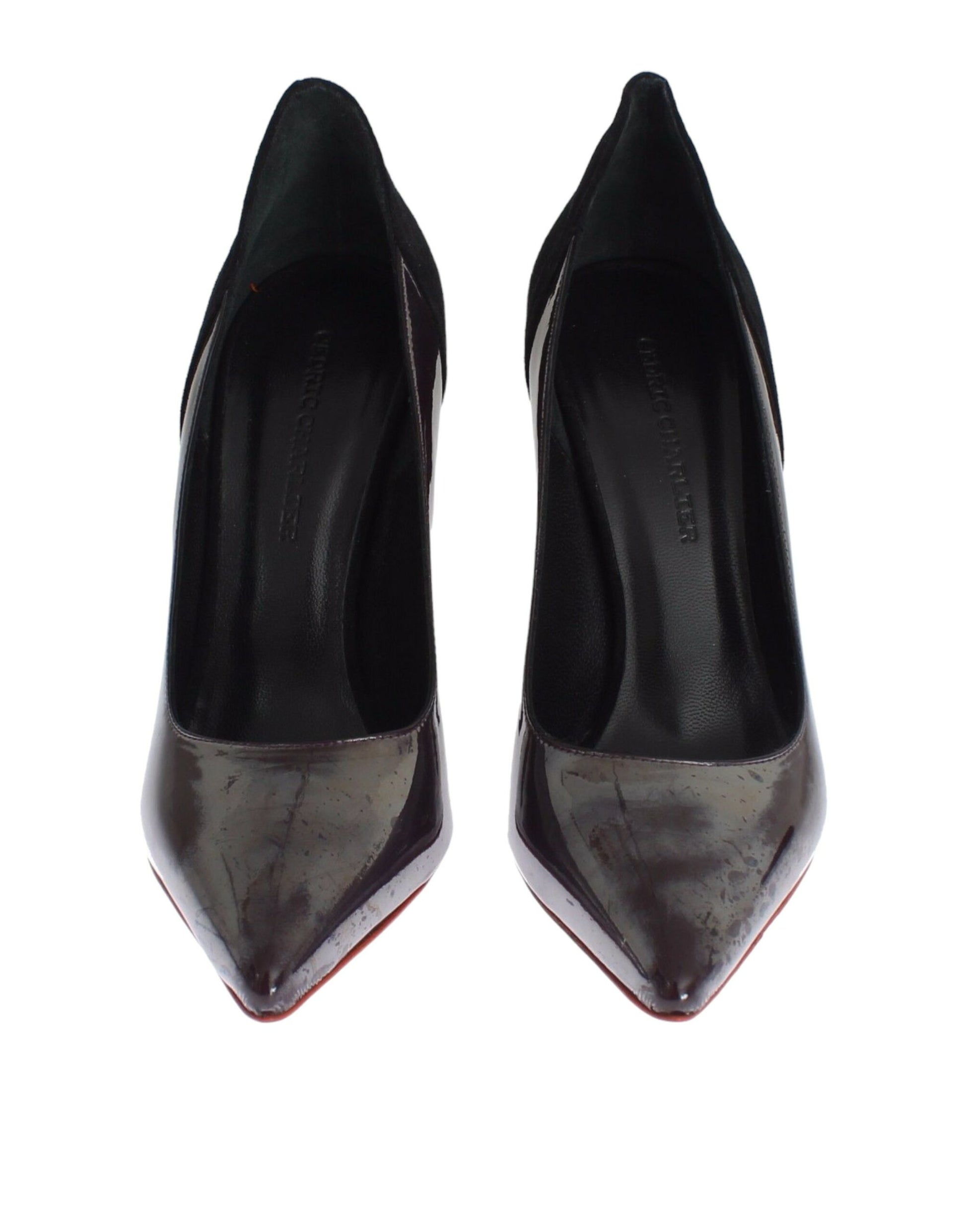 Pair of black high heel shoes with red trim and a bow on top