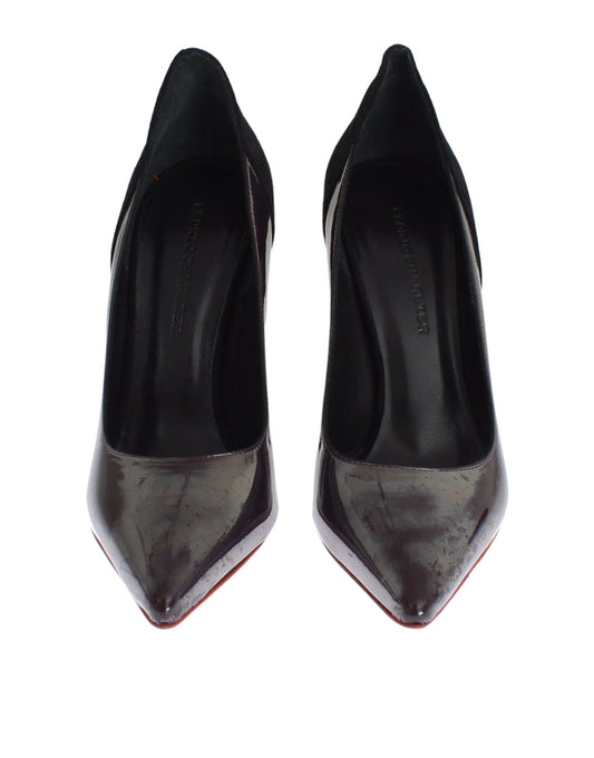 Pair of black high heel shoes with red trim and a bow on top