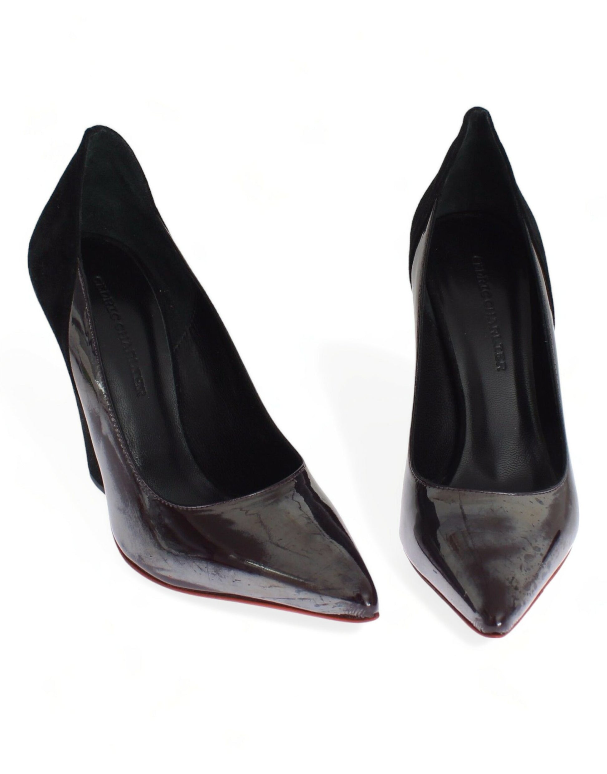 Pair of black high heel shoes with red soles