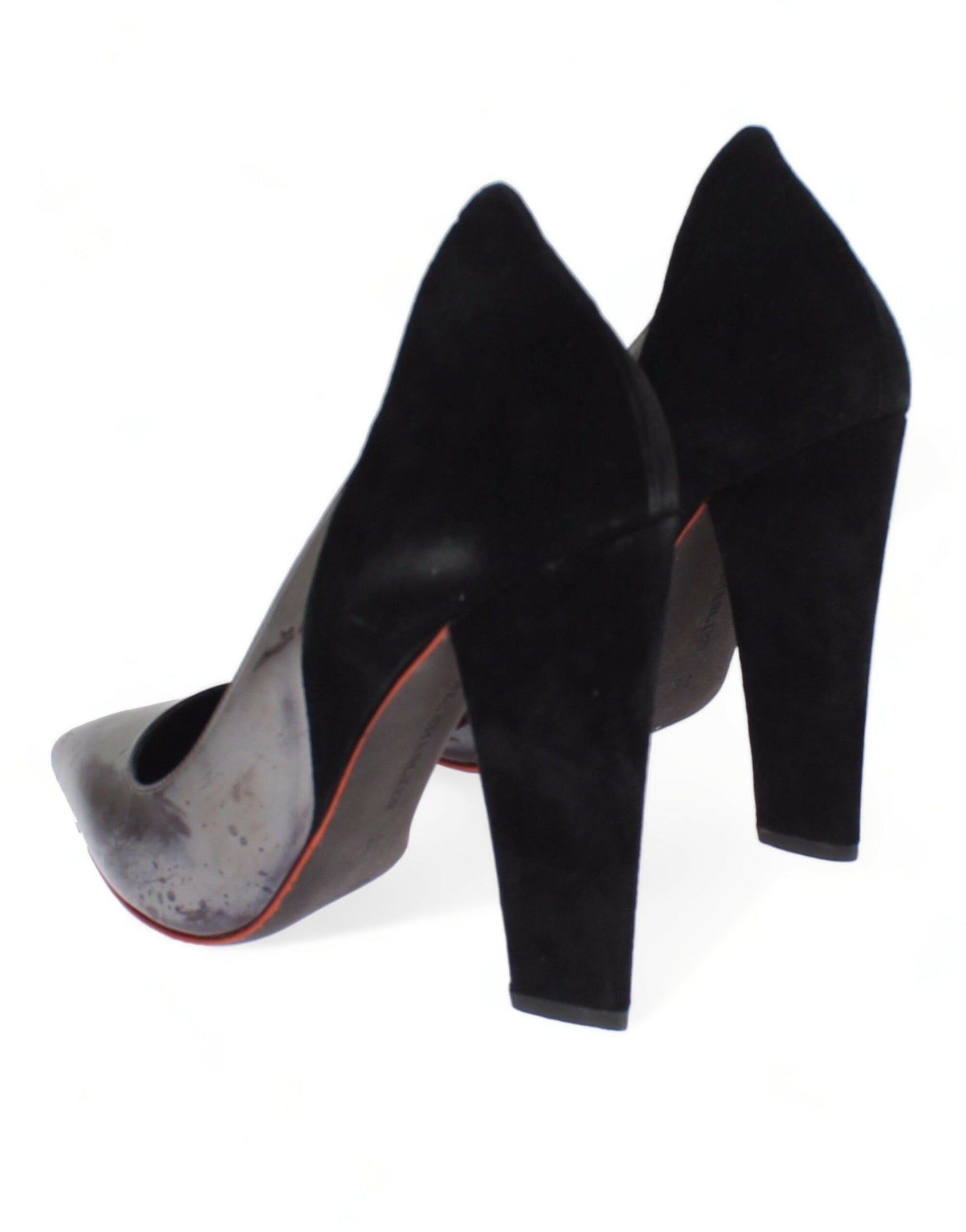 Pair of black high heel shoes with red trim and a pointed toe