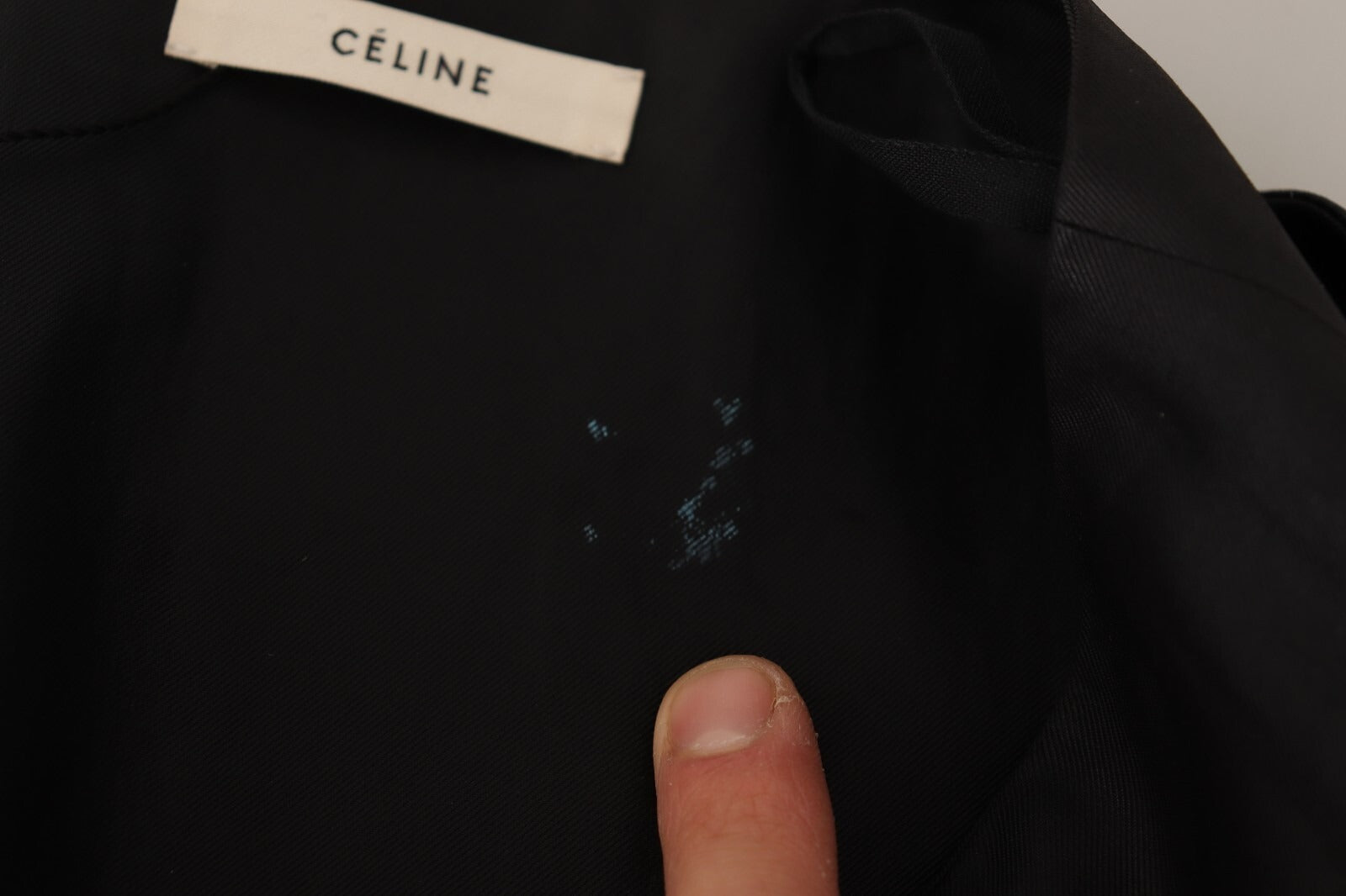 Black jacket with white label on front