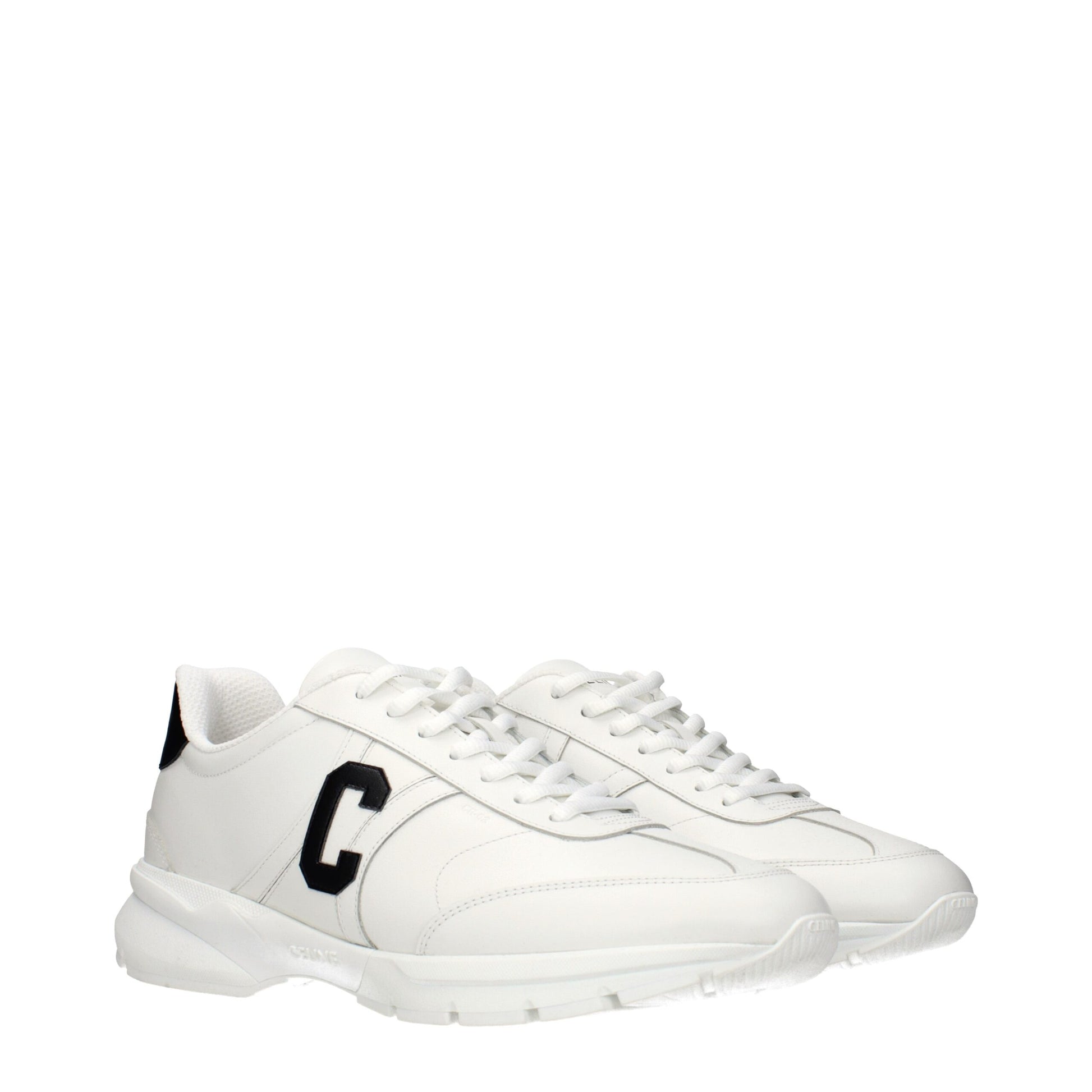 White leather athletic sneakers with black laces, featuring a logo on the side and a low-top design