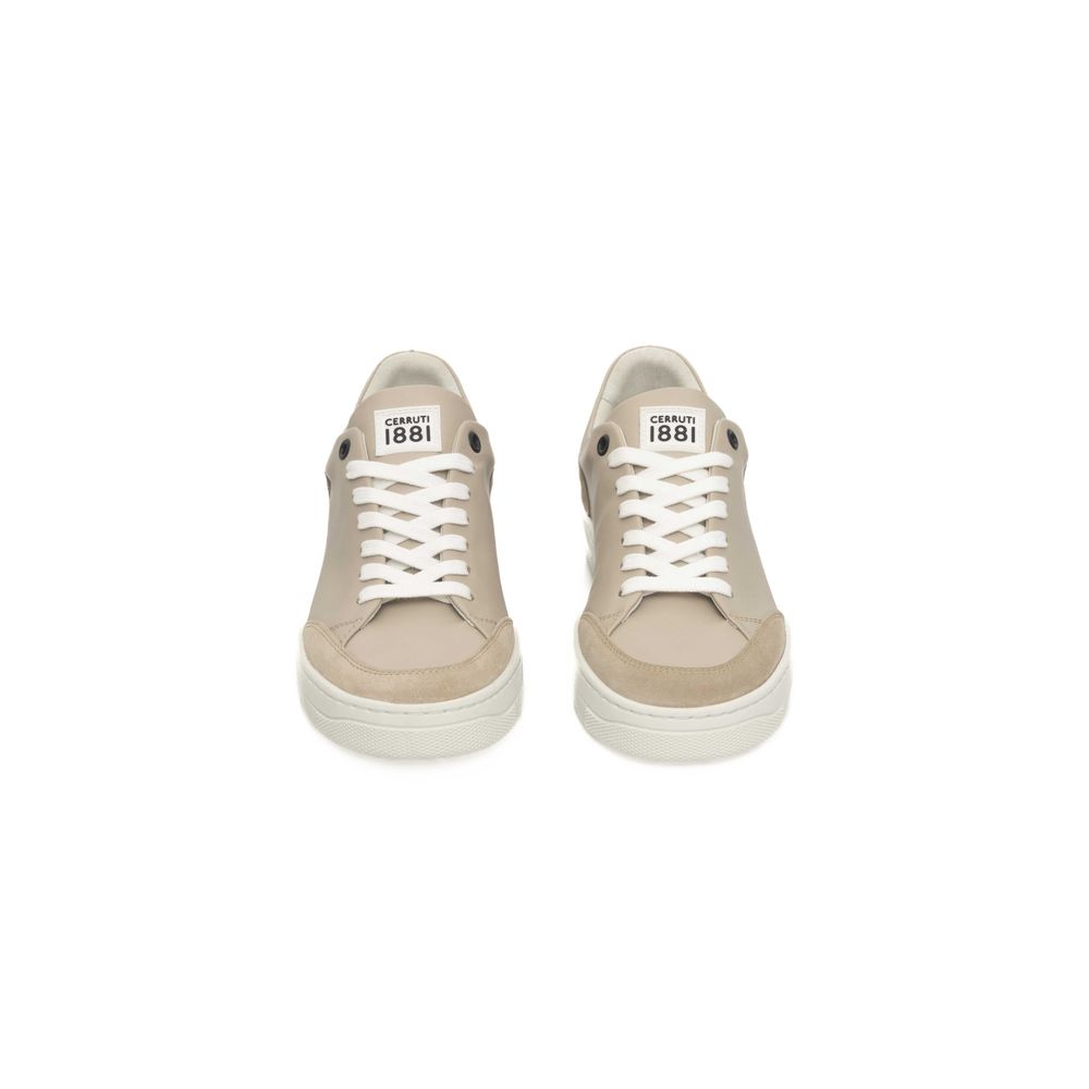 Pair of beige sneakers with white laces and a white sole