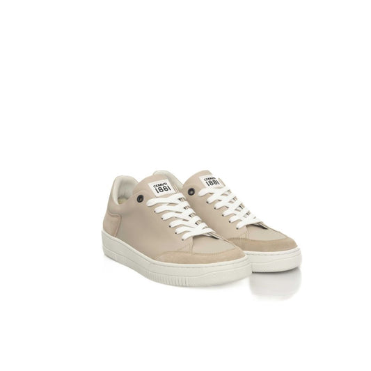 Tan sneakers with white laces and soles