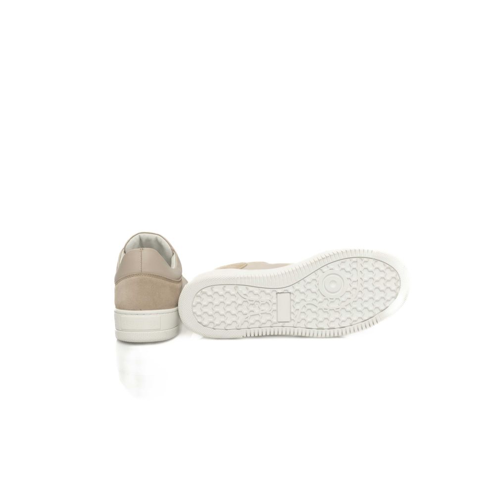 Pair of sneakers with white soles and tan upper