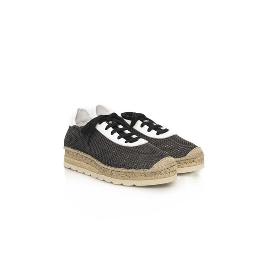 A black calfskin men's sneaker with white laces and a tan sole