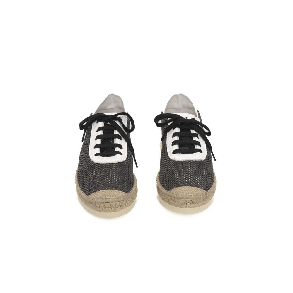 Pair of black sneakers with white laces, featuring a calfskin upper and a rubber sole