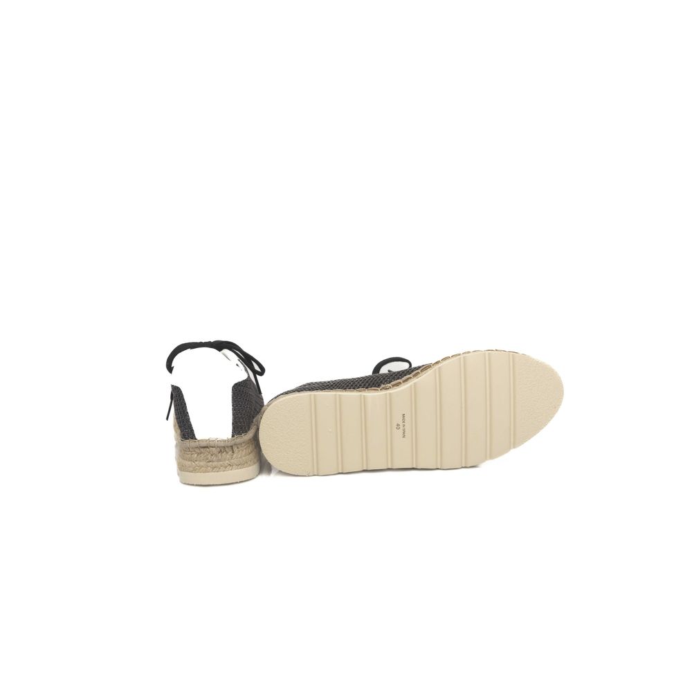 A single black calfskin men's sneaker with a white sole and laces