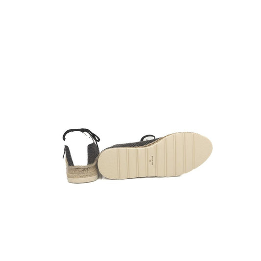 A single black calfskin men's sneaker with a white sole and laces