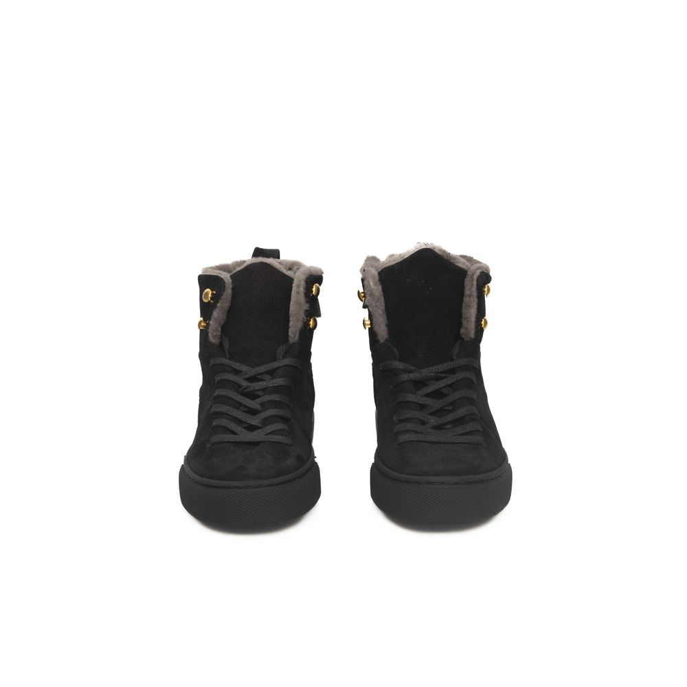 Pair of black women's sneakers with fur trim, gold buckles and laces