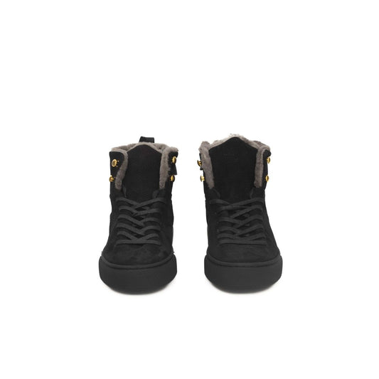 Pair of black women's sneakers with fur trim, gold buckles and laces
