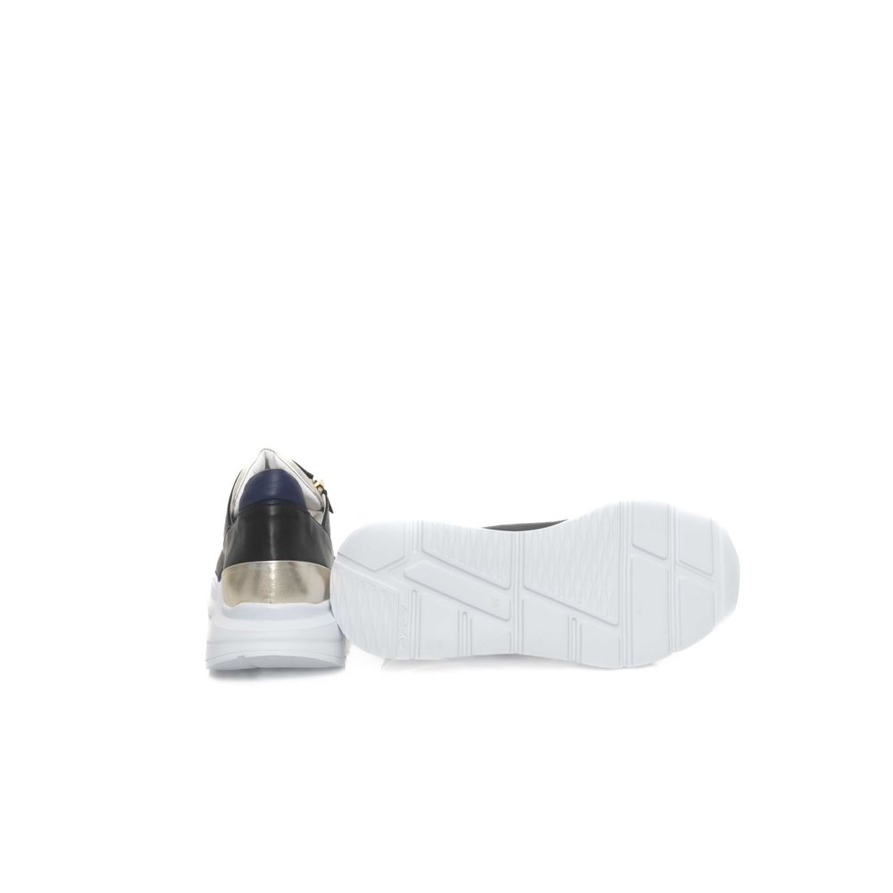 A black and white women's sneaker with a goatskin upper