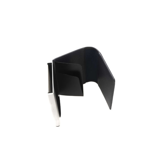 Black metal object with pointed end