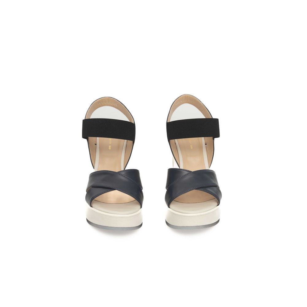 Pair of women's sandals with black straps and tan soles