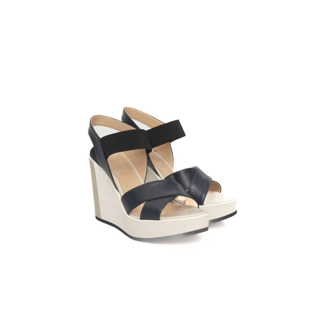 High heel sandal with black strap over foot