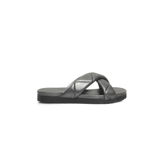 Black leather sandal with strap over foot and heel