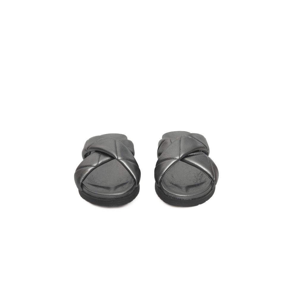 Pair of black slippers with a strap across the top