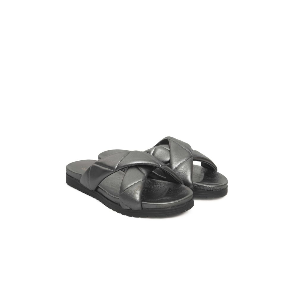 Pair of black leather sandals with a strap over the foot and ankle