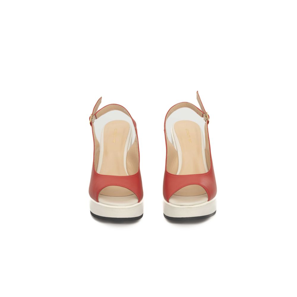 Pair of women's red high heel shoes with white soles