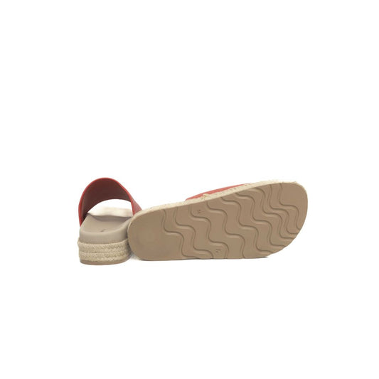 Brown sandal with red sole