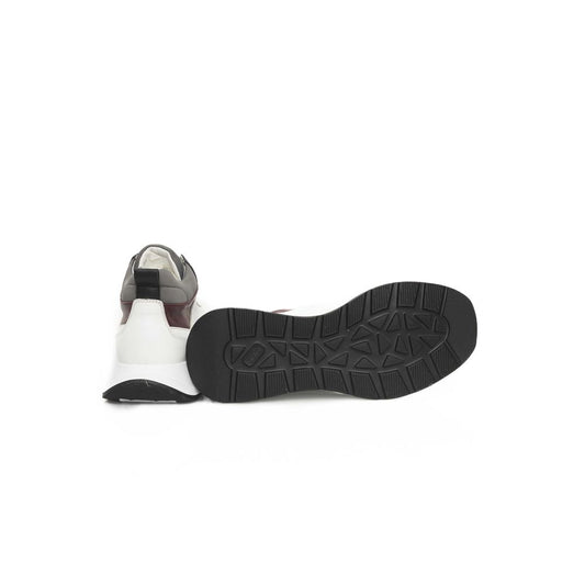 A single white sneaker with a black sole, featuring cow leather and a lace-up design