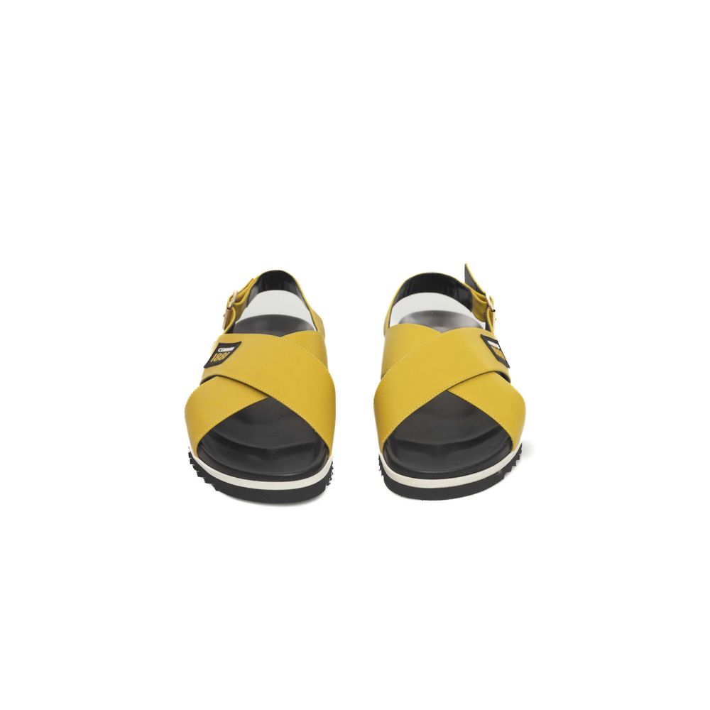 Pair of yellow and black sandals with straps