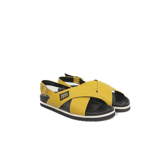 Yellow and black sandals with white soles