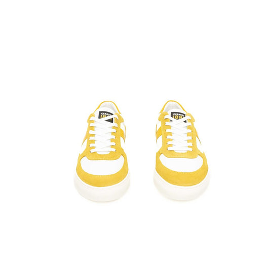 Yellow cowhide men's sneakers with white laces and soles, featuring a low-top design