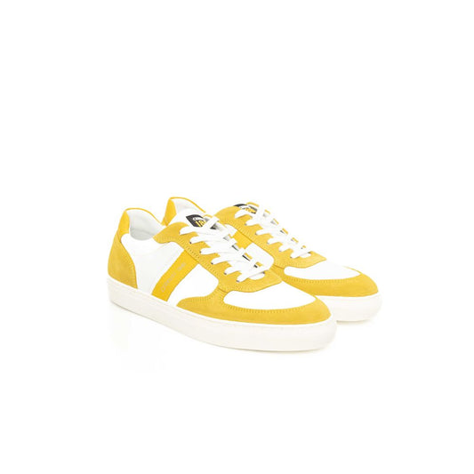 Yellow sneakers with white laces, cowhide texture, and black logo on side