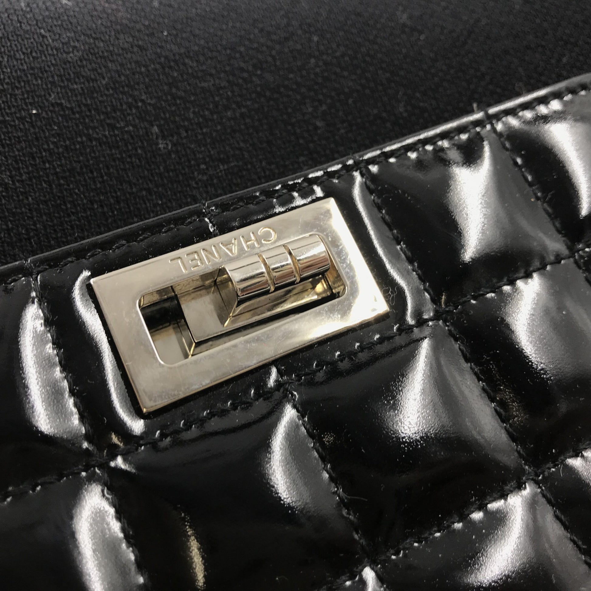 Black leather clutch purse with gold hardware