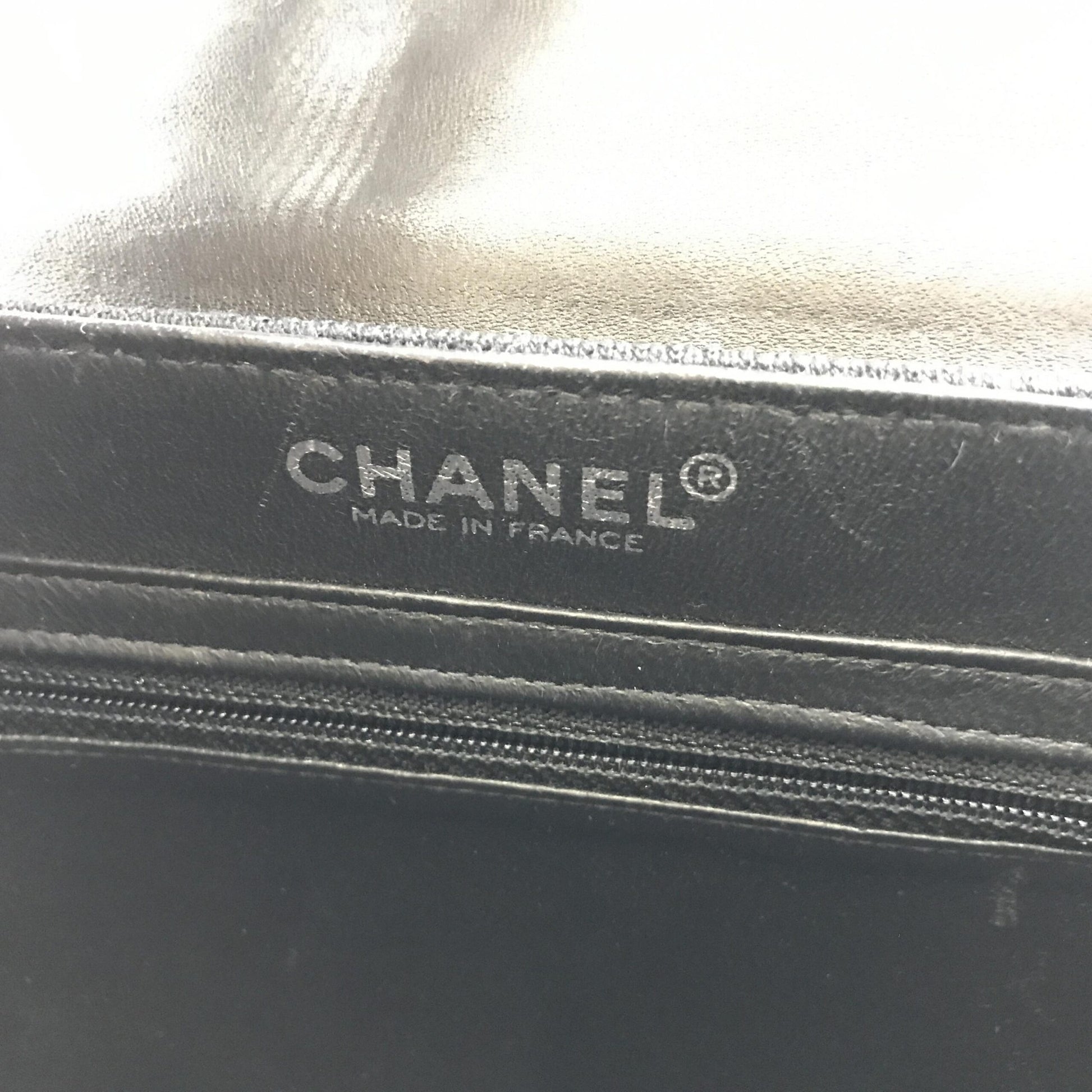 Black leather wallet with gold logo