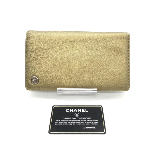 Gold leather wallet with logo on front