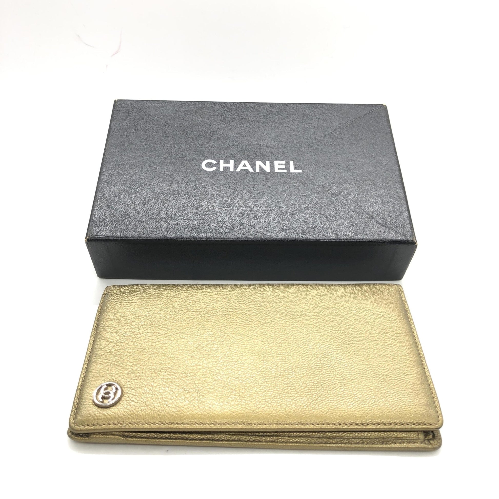 Black box containing gold wallet