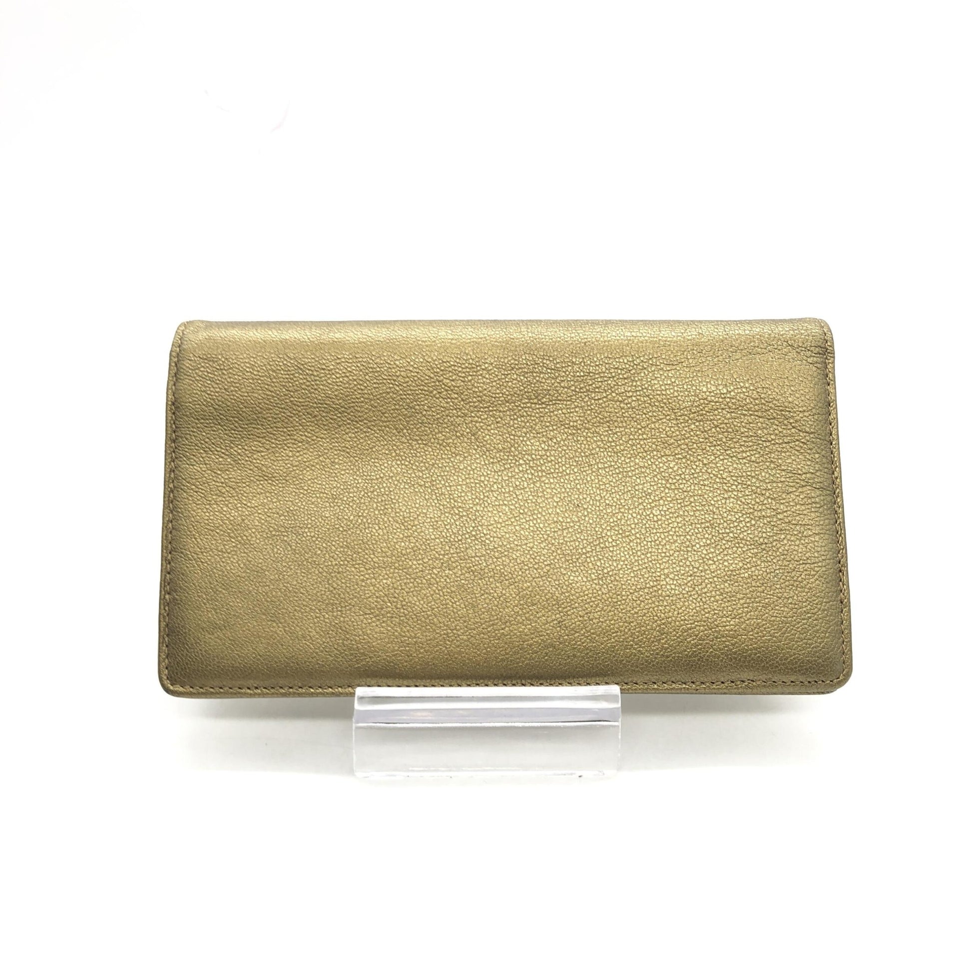 Gold clutch purse with embossed texture