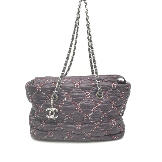 Purse with chain strap and logo on front