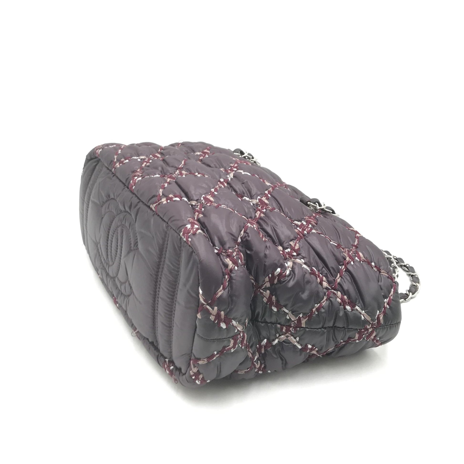 Grey quilted bag with red trim