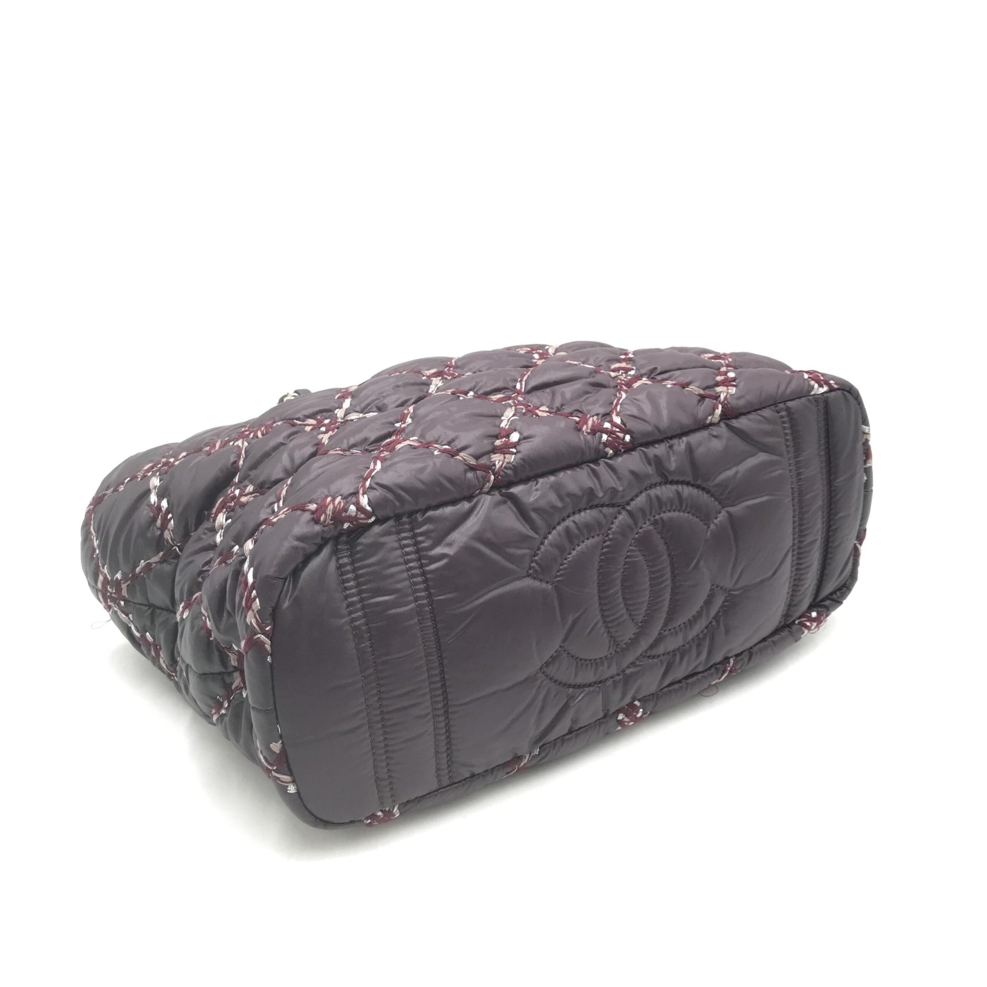 Purple quilted bag with embroidered design