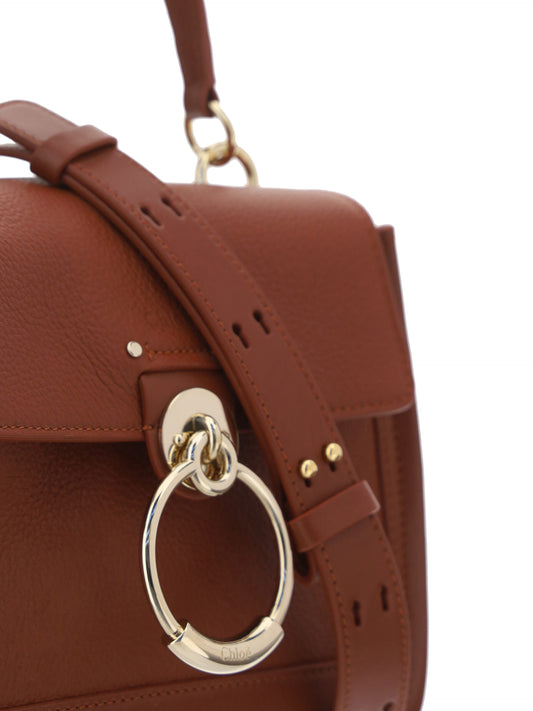 Brown leather handbag with silver hardware