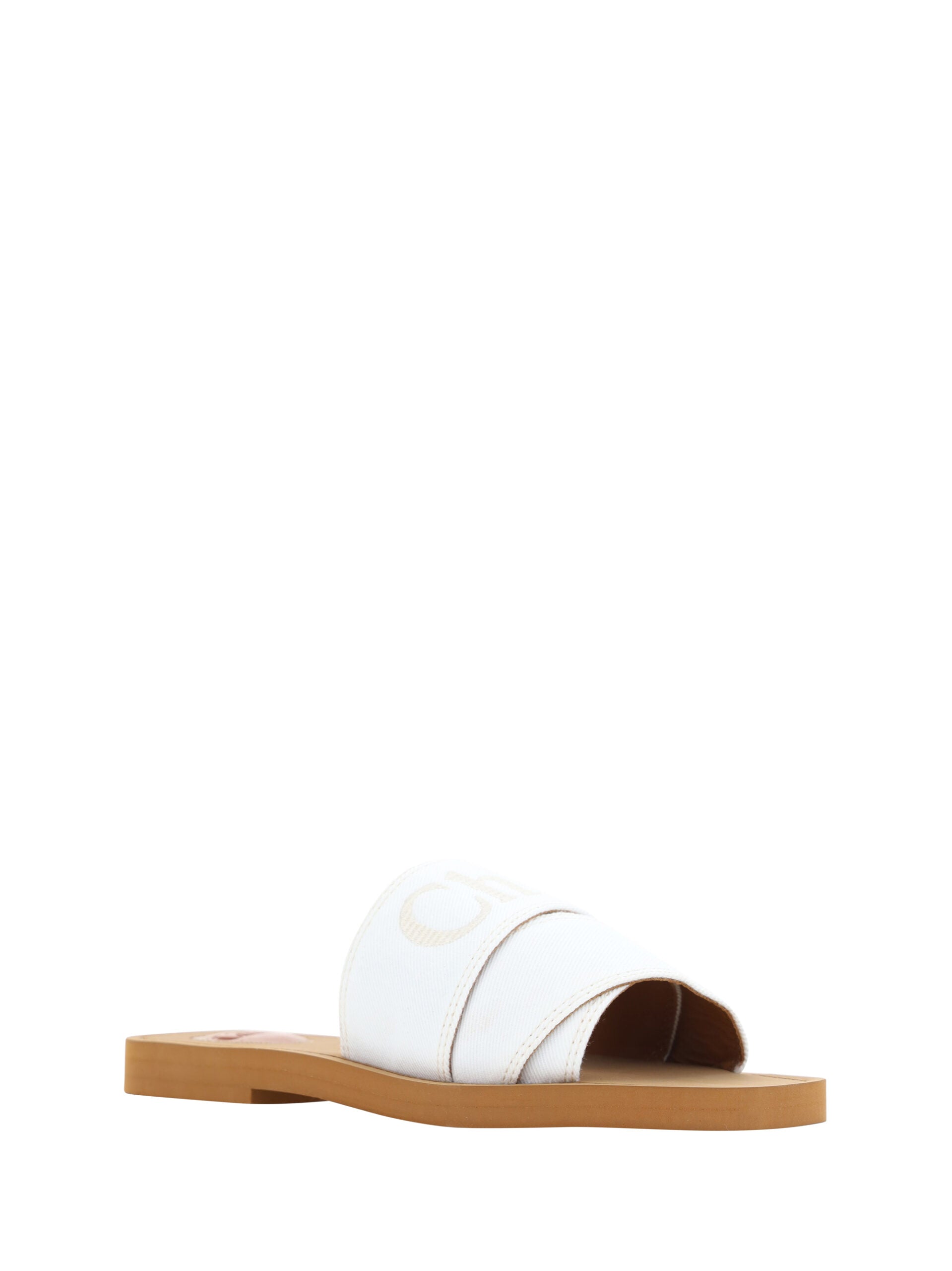 Pair of brown flip flops with white soles and straps