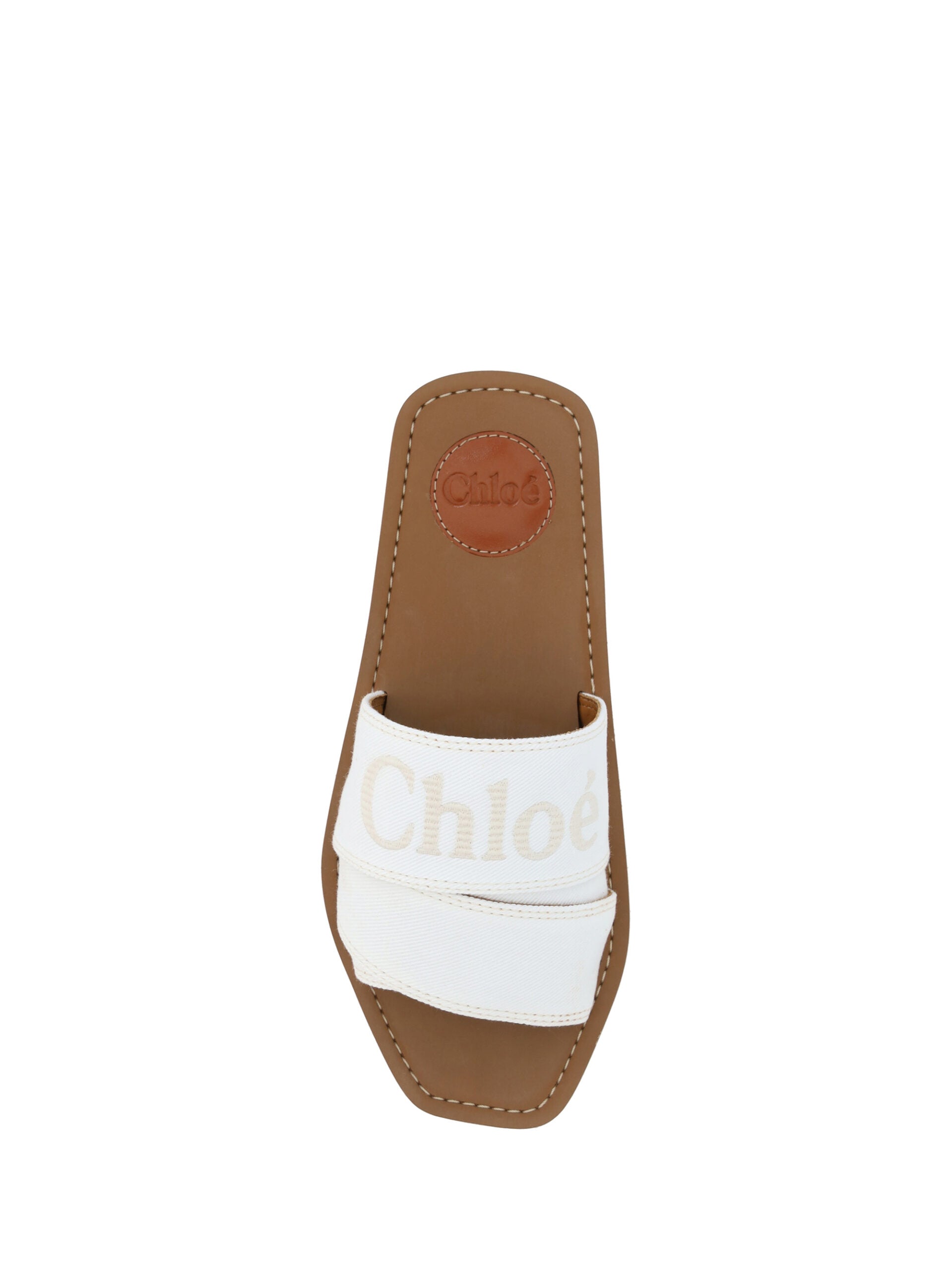 Brown sandal with white strap and logo on heel