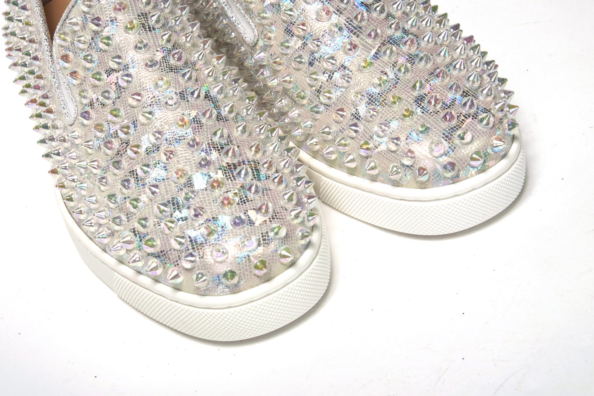 Pair of glittery shoes with white soles