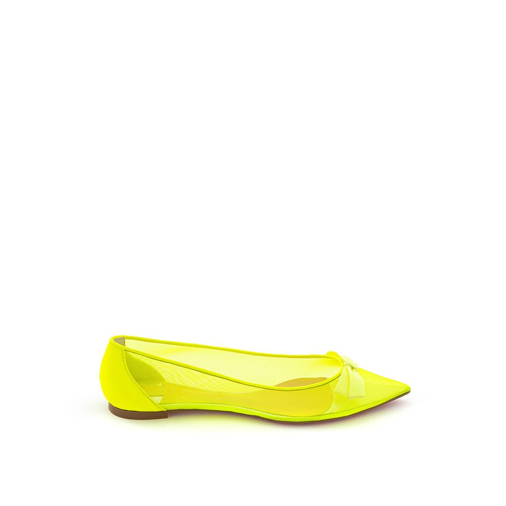 Yellow women's flat shoe with a pointed toe and a strap over the top of the foot